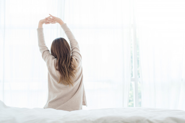 a girl wake up in the morning