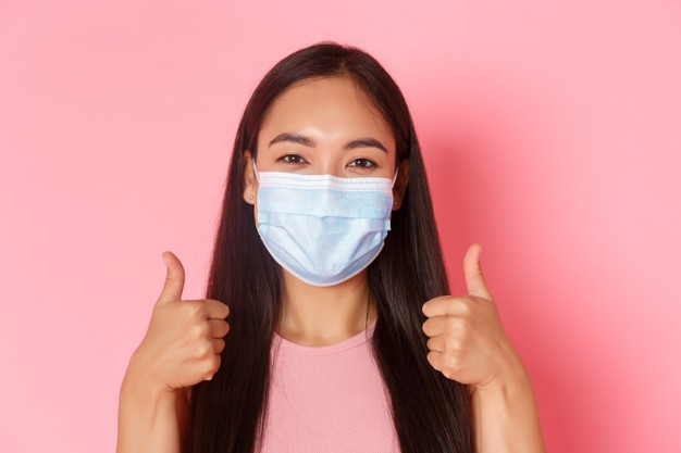 expressive young woman wearing mask