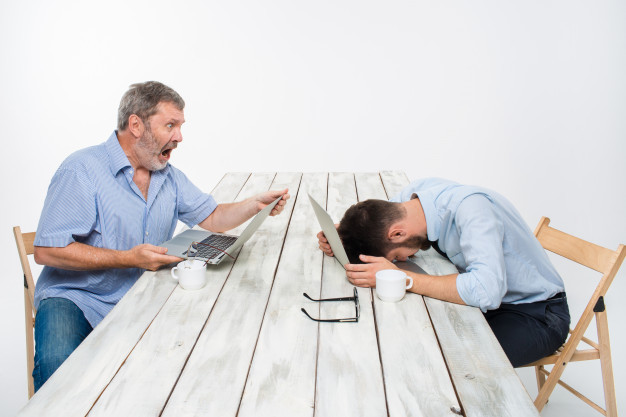 Two colleagues working together at office